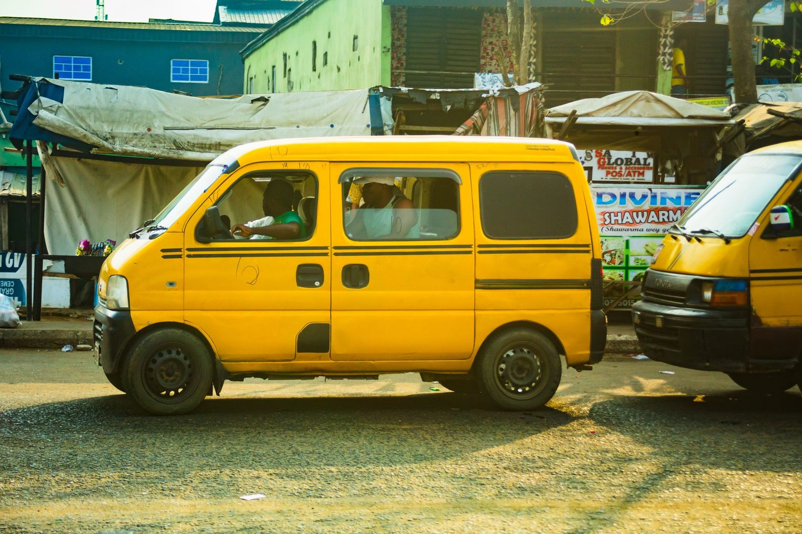 Yellow danfo minibus on a busy Lagos street