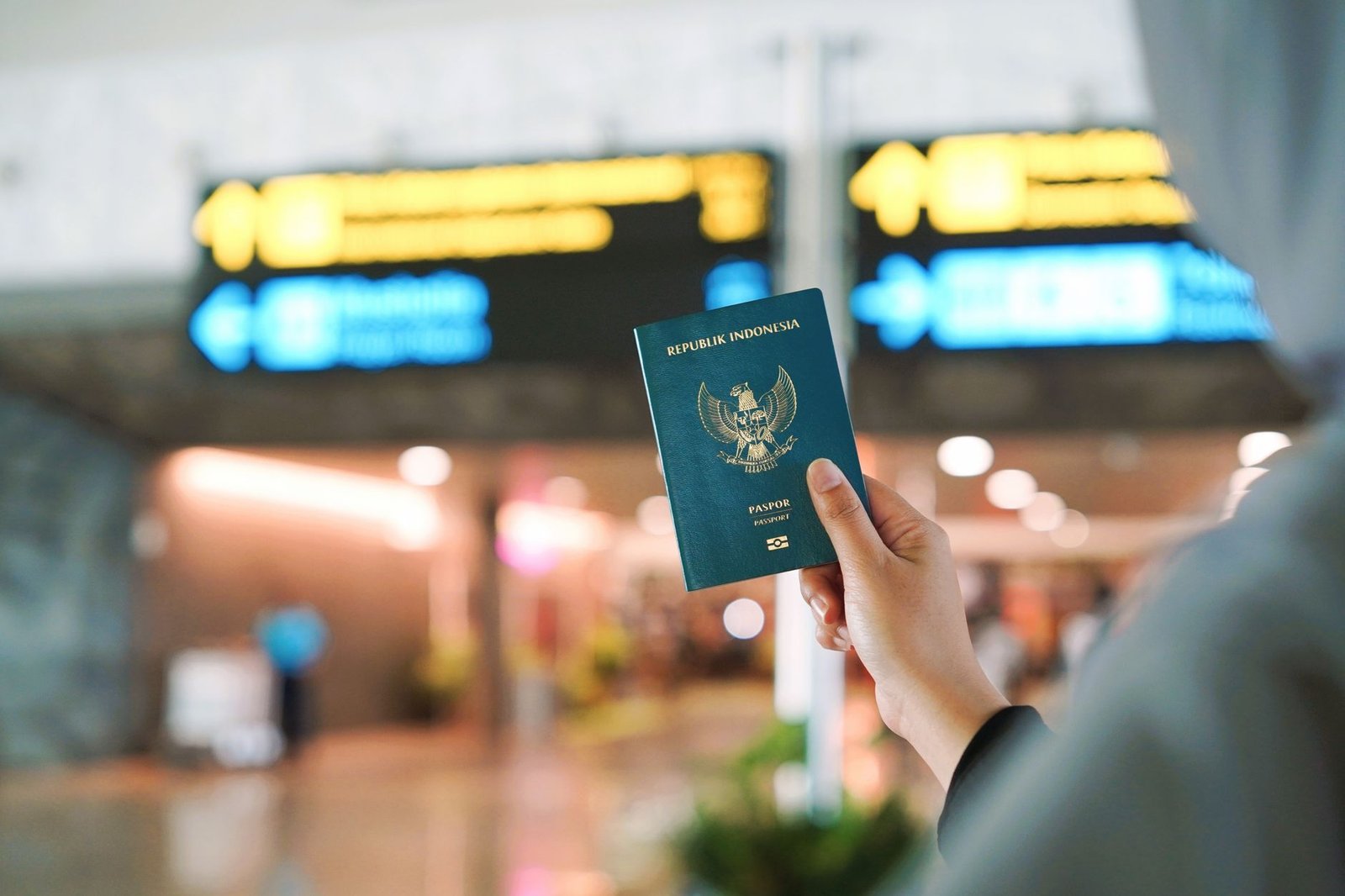 Traveler checking passport documents at an airport