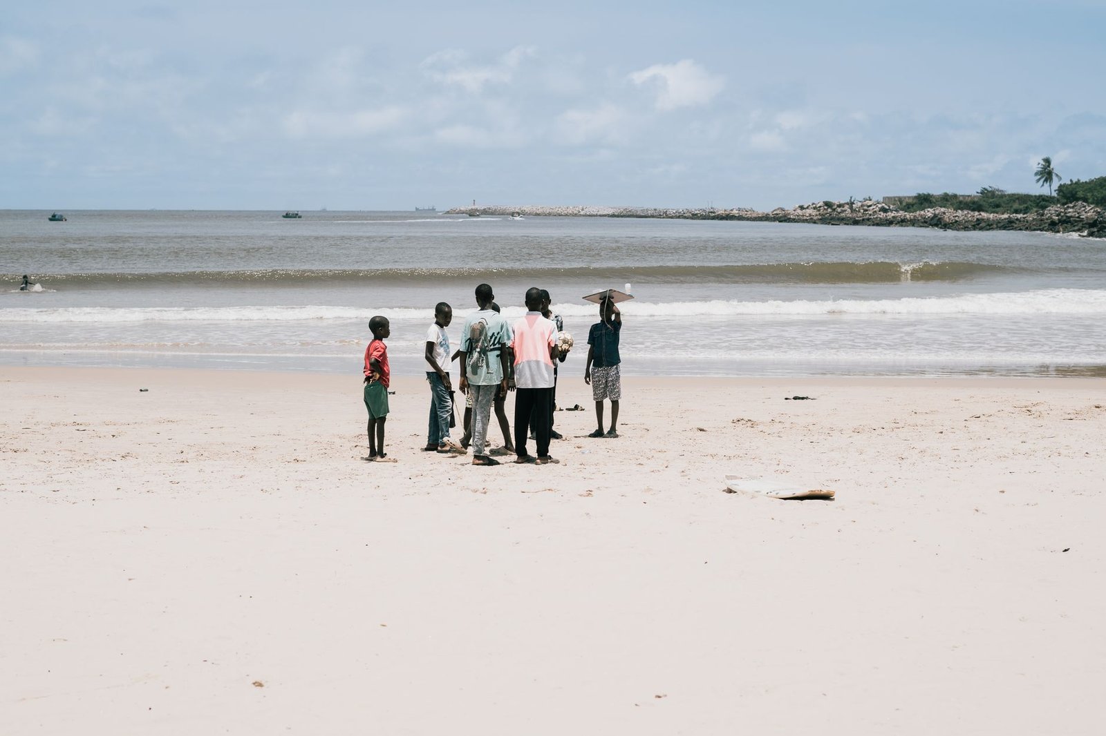 A group enjoying a sunny day at a beach in Lagos, Nigeria.