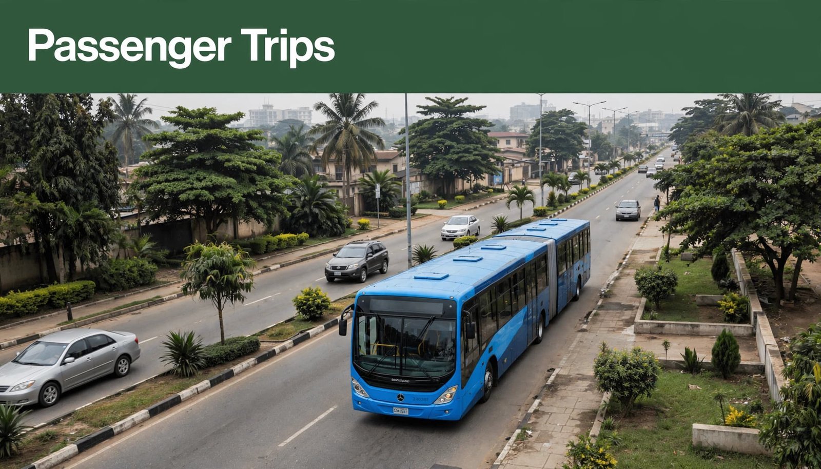 A red BRT bus moves along a Lagos road beneath a green