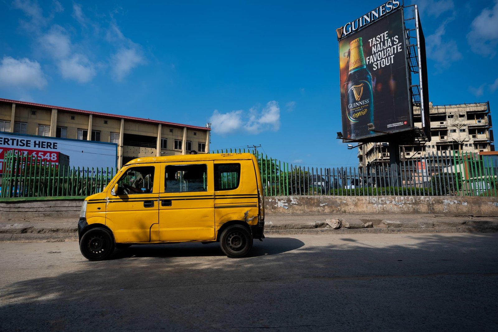 Danfo bus in a busy Lagos street scene